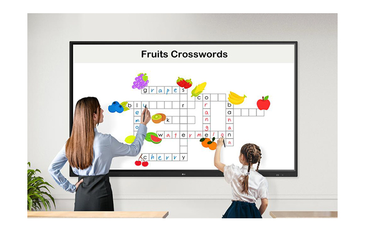 A teacher and a child are solving crosswords puzzles on the display together, using the Stylus Pens.